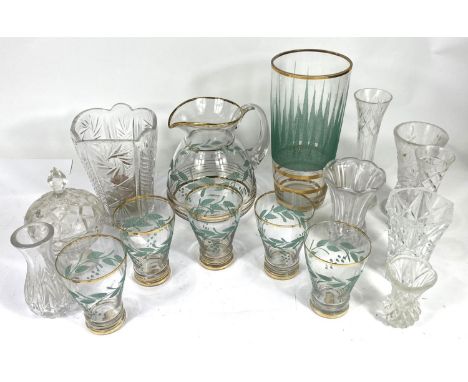 A vintage lemonade set of 5 glasses and jug with gilt and green lesf decoration; a similar vase and glassware 