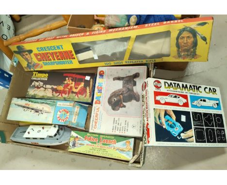 A selection of originally boxed vintage toys including "Cheerful Daschund"; Police Launch "Cheyenne" Riffle. 