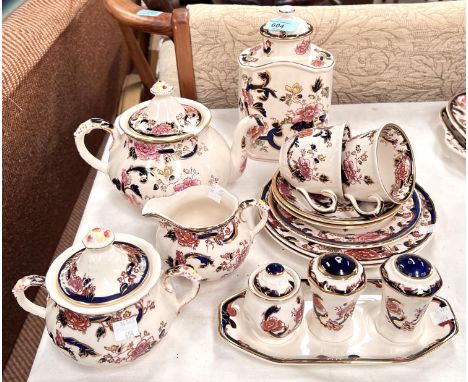 A Masons Mandalay tea for 2 service with 2 cups and saucers, 2 plates, tea caddy, sugar and milk jug and a 3 piece cruet on s
