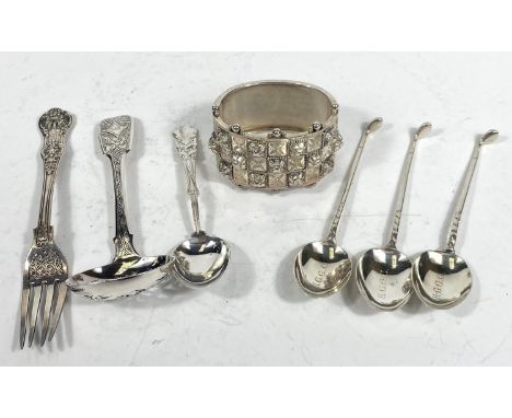 A pierced sifter spoon; 4 small hallmarked silver teaspoons and a flask, various dates, 4oz; a white metal hinged bangle 