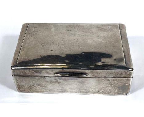 A hallmarked silver rectangular cigarette box with hinged lid and weighted base, London 1903 (some dents) 