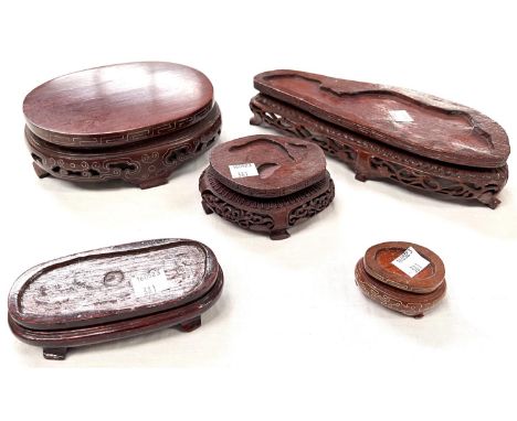 A selection of Chinese carved wooden stands 1 with silver inlay 