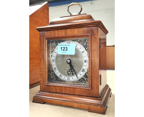 A small Georgian style walnut cased bracket clock 