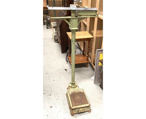 A set of cast metal floor standing mediacal scales in green and chrome 