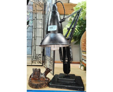 A vintage angle poise lamp; a WWI carved camel souvenir. 