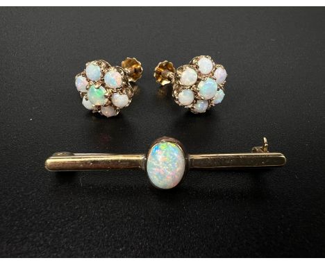 A pair of screw earrings set opal coloured stones as a flowerhead, stamped '375', 3.2gm; a bar brooch set opal coloured stone