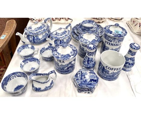A good selection of Spode Blue Italian china including 2 teapots, 5 cups, 4 saucers, a salt and pepper, 4 named storage jars 