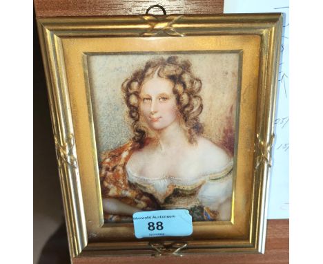 A miniature rectangular portrait:&nbsp; young woman in low cut dress, oil on panel, framed and glazed 