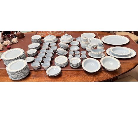 A large quantity of Wedgwood & Barlaston embossed blue Queensware, approx 106 pieces, including dinner plates, side plates, s