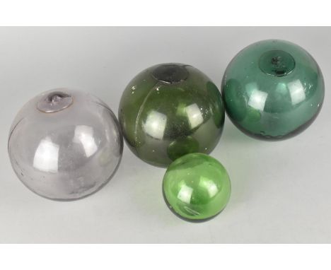 A Collection of Four Vintage Coloured Glass Fishing Floats, 13cm and 7cm Diameters 