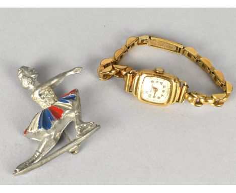 A Vintage Metal Brooch Modelled as an Ice Skater Together with a Vintage Ladies Shields Wristwatch