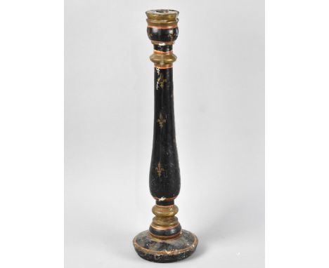 A Turned Wooden Candlestick with Painted and Fleur de Lys Decoration, 46cm High 