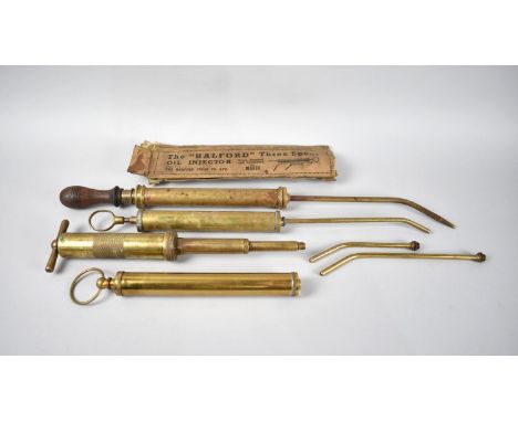A Collection of Vintage Brass Tools to Include Grease Gun and Three Spout Injectors 