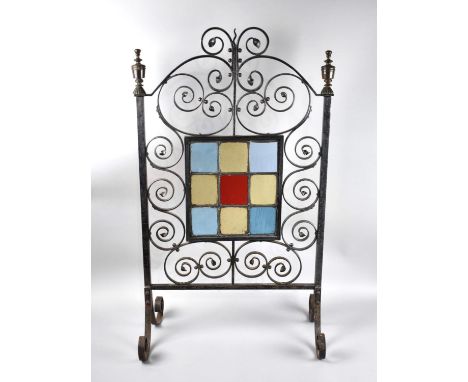 A Wrought Iron and Leaded Coloured Glass Firescreen with Scrolled Feet, 46cm Wide and 79cm high 