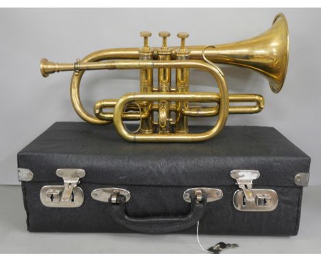 A brass cornet, in handheld case