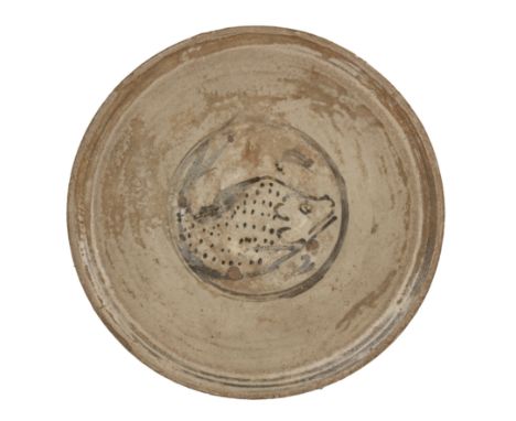 Sukhotai slip-painted ‘fish’ dishThailandwell-potted, decorated with painted designs of a fish swimming in a pond, 26.3cm dia