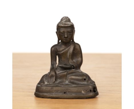 Bronze seated model BuddhaBurmesewith arms in bhumisparsha mudra, 12cm highProvenance: the late Oliver Watson (1949-2023), Em