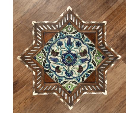 Damascus pottery tileSyria, late 16th/17th Centuryset in a later Damascus star design table, with mother-of-pearl and bone in
