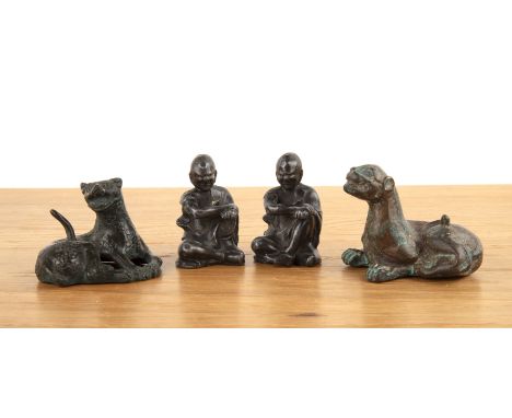 Two bronze scroll weights Chineseeach in the form of a leopard; together with an unusual pair of scroll weights, Chinese, lea