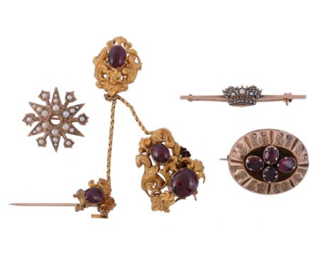 A small collection of brooches, comprising a damaged garnet set brooch   A small collection of brooches,   comprising a damag