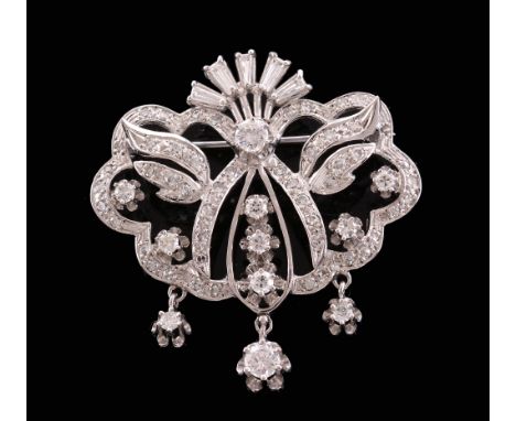 A scrolled foliate diamond brooch, the pierced scrolled panel set with eight...   A scrolled foliate diamond brooch,   the pi