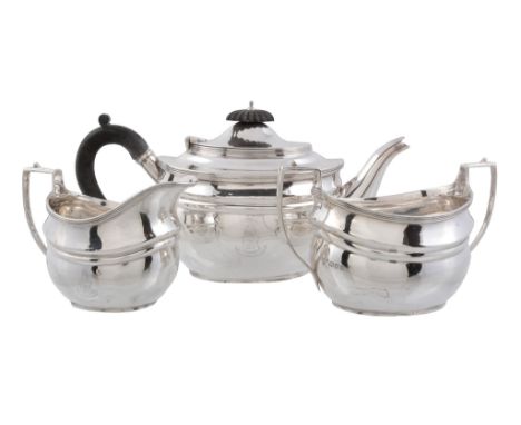 A silver oval three piece tea service by Harrods Ltd   A silver oval three piece tea service by Harrods Ltd.,   London 1919, 