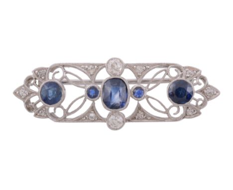 A sapphire and diamond brooch, the rectangular shaped panel with pierced...   A sapphire and diamond brooch,   the rectangula