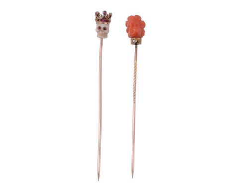 A mid 19th century ivory and ruby skull stick pin, circa 1860   A mid 19th century ivory and ruby skull stick pin,   circa 18