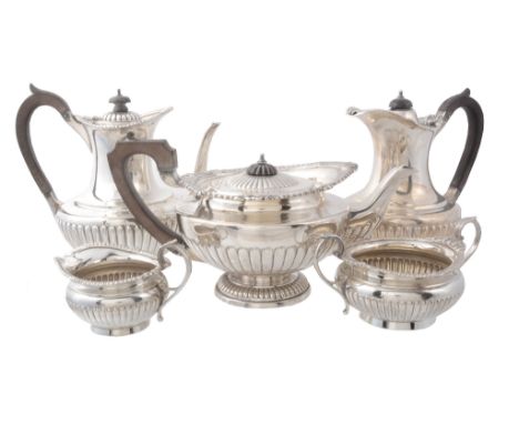 A matched silver five piece tea service, the tea pot by Elkington  &  Co   A matched silver five piece tea service,   the tea