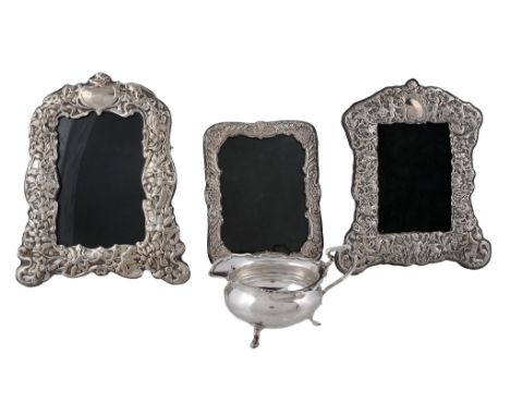 Three various silver mounted shaped rectangular embossed photograph frames   Three various silver mounted shaped rectangular 