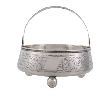 A Russian silver circular swing handled sugar basin, maker's mark NL , Tula   A Russian silver circular swing handled sugar b