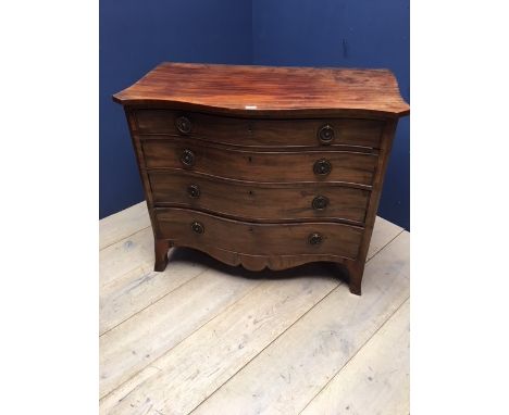 George 111 mahogany serpentine fronted commode with plaint top, 4 long graduated drawers with circular brass handles and supp