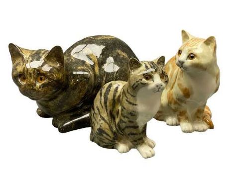 MIKE HINTON CERAMIC CATS WITH GLASS EYES (3) - signed to the bases, 17.5cms H, 30cms L the largest