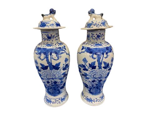 CHINESE BLUE & WHITE LIDDED VASES, A PAIR - Late 19th/early 20th. Prunus, peony and sparrows. Apocryphal 4-ch Kangxi mark. Da