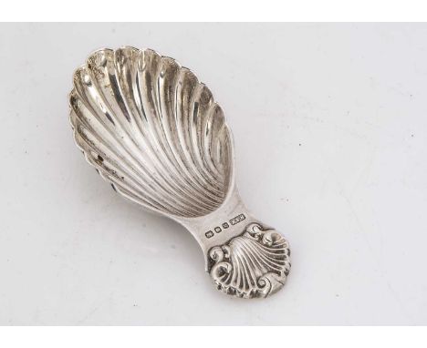 A 1960's silver tea caddy spoon by R&K, length 8.0cms, 0.7 ozt, with shell shaped bowl and shell motif to handle