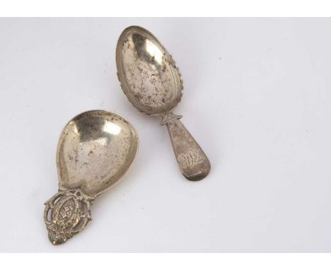 Two silver tea caddy spoons, one George III example with engraved well and initials, by TJ, the other from the Artificer's Gu