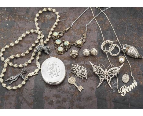 A quantity of silver and base metal jewels, including an Arts and Crafts Vauxhall glass necklace, an oval locket with monogra