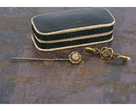 A 15ct gold bar brooch, with gypsy set diamond chip, and a similar stick pin, 2.8g