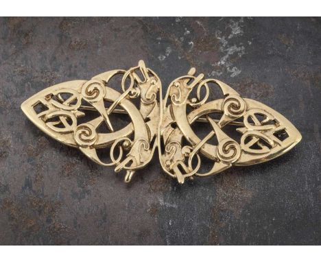 A 9ct gold Celtic brooch, the pierced design of mythical serpent headed creatures within a sinuous oval shape, 7cm x 3.1cm wi