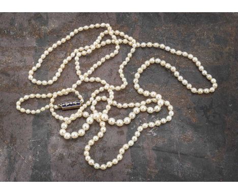 A certificated string of natural saltwater graduated knotted strung pearls, of opera length, united by a diamond enamel recta