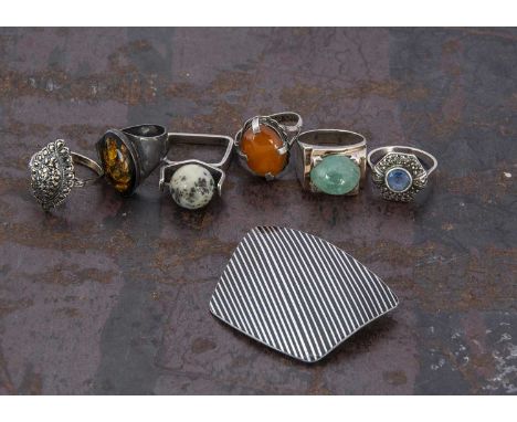 A Jorgen Jensen Danish pewter brooch, of cushion shape with a diagonal black enamel banded decoration numbered 902 to reverse