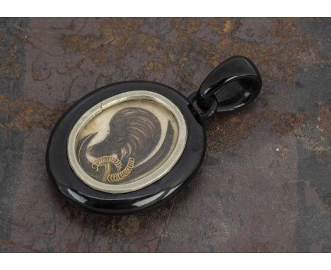 A 19th jet locket, with plated hair panel, 5.3 cm by 3 cm 9g