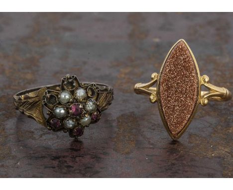 A 19th Century hallmarked 12.5ct posey ring, the cluster setting with seed pearls and rubies with an engraved shank (af to sh