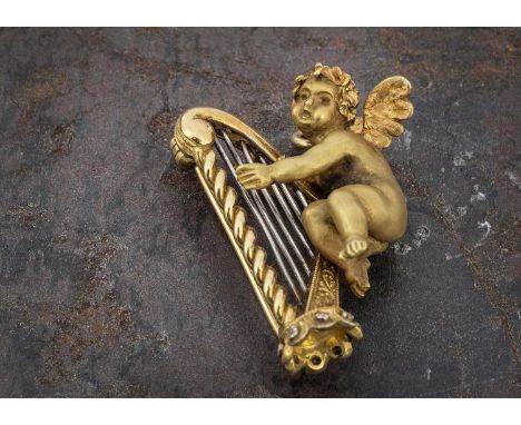 A Continental 18ct gold brooch or pendant depicting Cupid playing harp, with a satin finish to Cupid and two colour gold to h