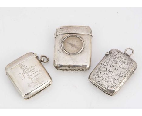 Three Victorian and later silver vesta cases, one with initials WP and dated 1898, the other with later inset compass, and on