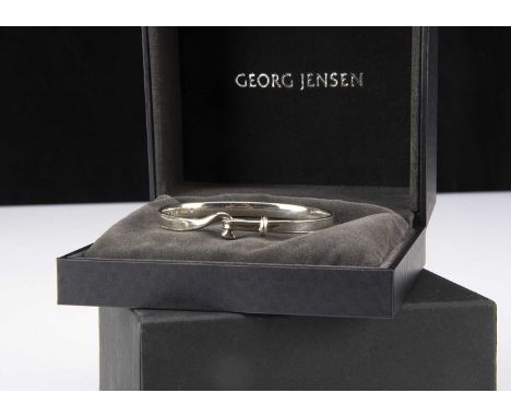 A Georg Jensen silver bangle, no. 204 designed by Torun, 4.6 cm by 6 cm, boxed bangle 16g
