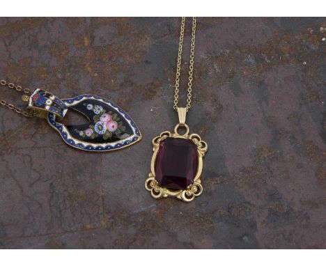 An early 20th century enamel drop pendant on a base metal chain, floral design and a paste set 14 k front and back paste set 