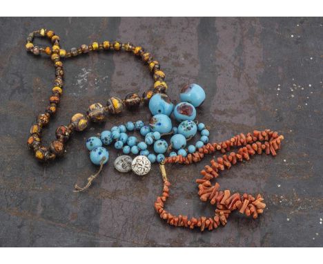 A late 19th century string of Vauxhall glass beads,  20 cm together, a sting of coral batons and other items