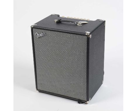 A Fender Rumble 500 bass combo amplifier, with black vinyl cabinet, footswitch and power cable.