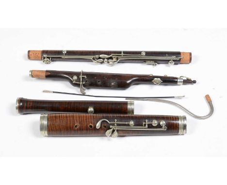 A vintage Hawkes bassoon, in figured wood with nickel keys, in vintage leather Hawkes case.